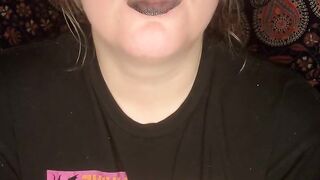 smoking a cigarette with black lipstick