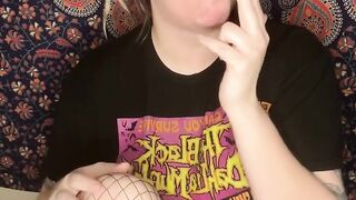 smoking a cigarette with black lipstick