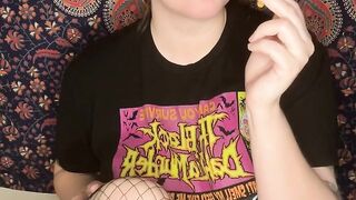 smoking a cigarette with black lipstick