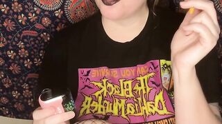 smoking a cigarette with black lipstick