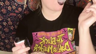 smoking a cigarette with black lipstick