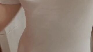 The girl crumples elastic tits, shows dried discharge on her panties and pisses